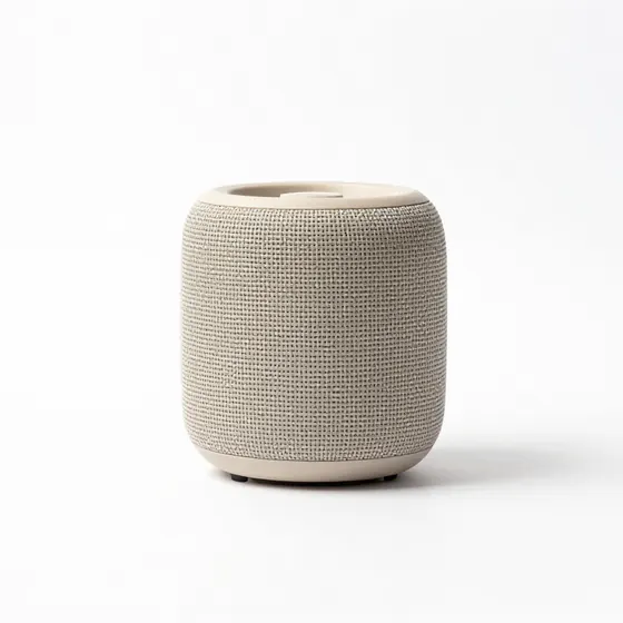Beige portable speaker product photo without labels